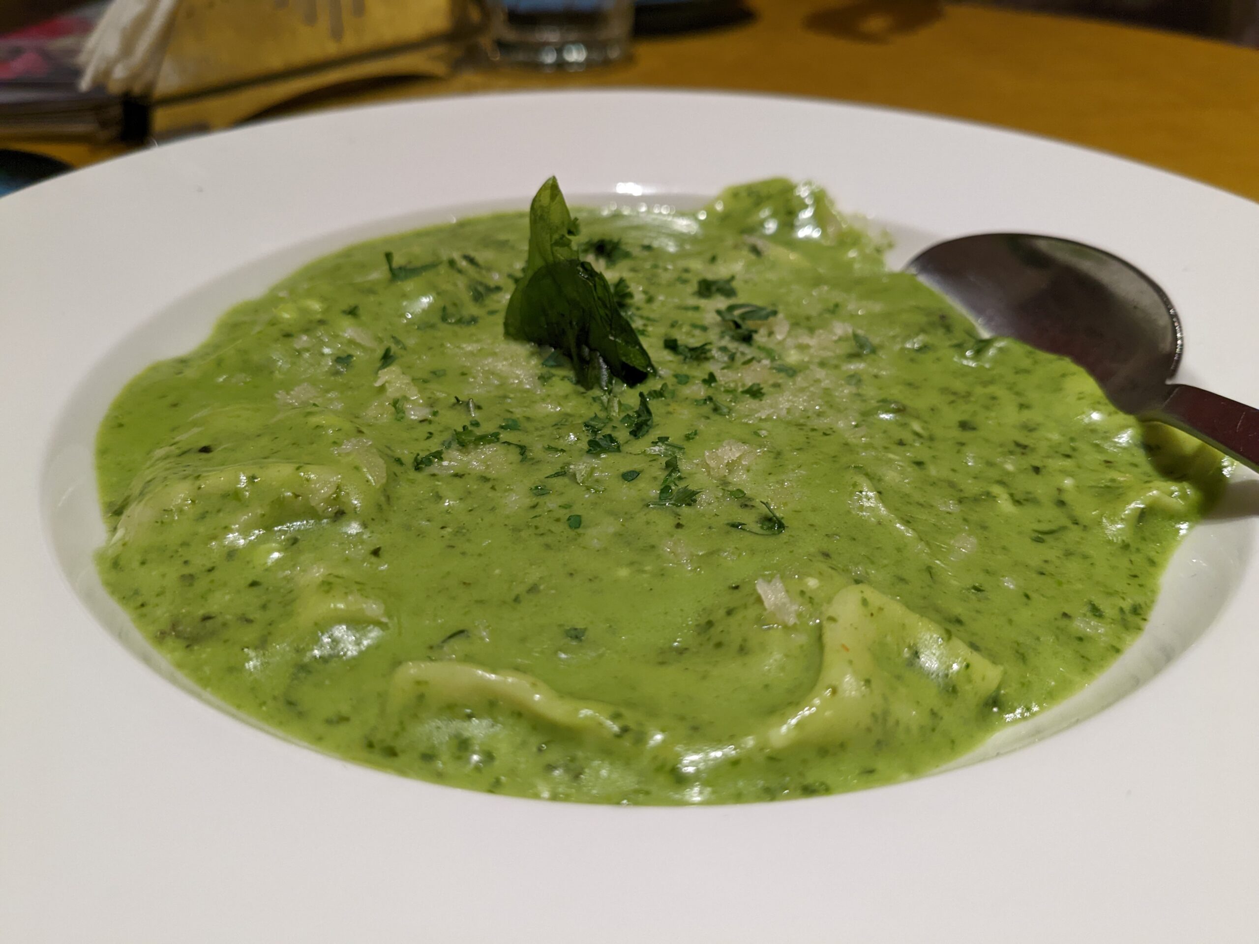 asparagus and mushroom ravioli in pesto sauce from canto cafe bar